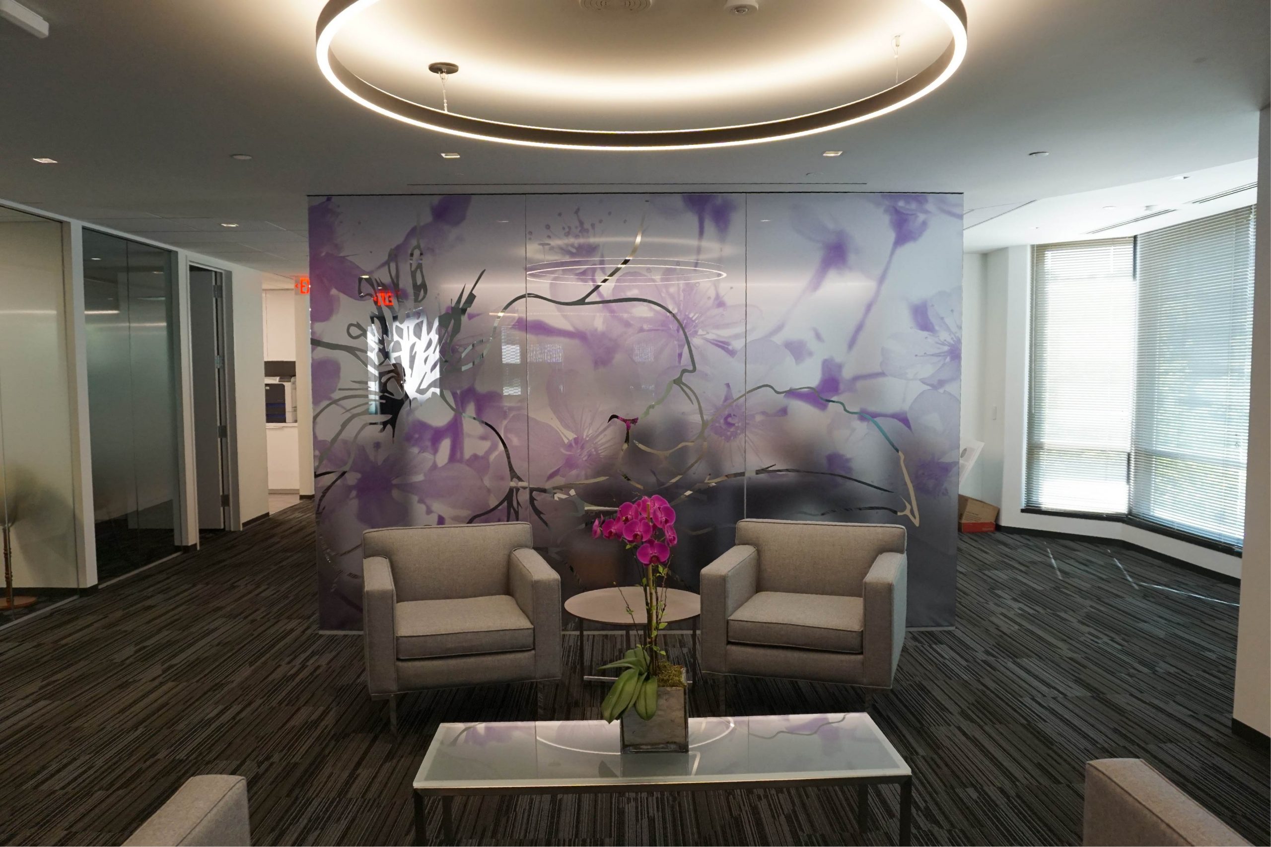 3m science for life office lounge with beige chairs, circular light, and purple commercial graphic decorative film in flower pattern